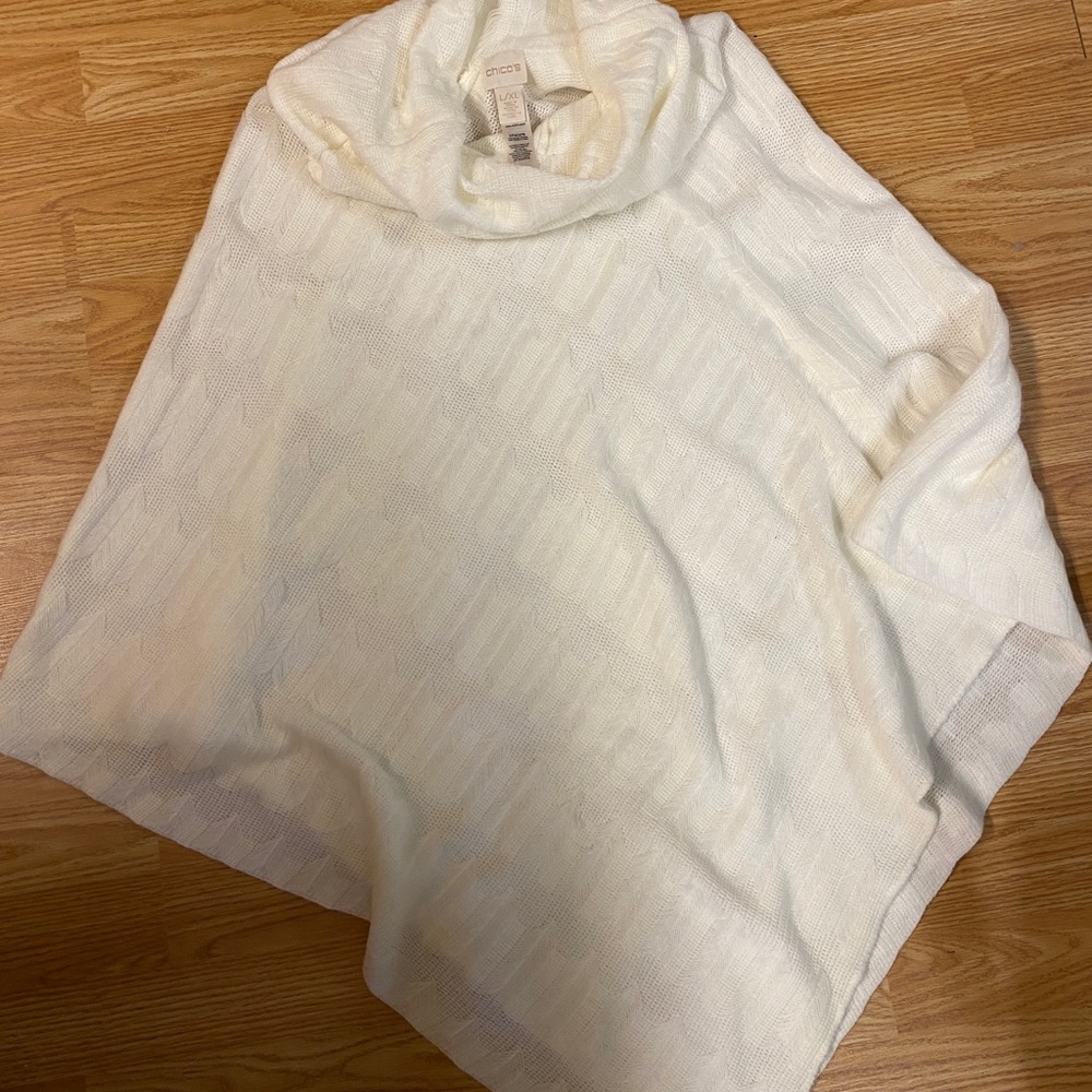 Cream colored knit poncho.